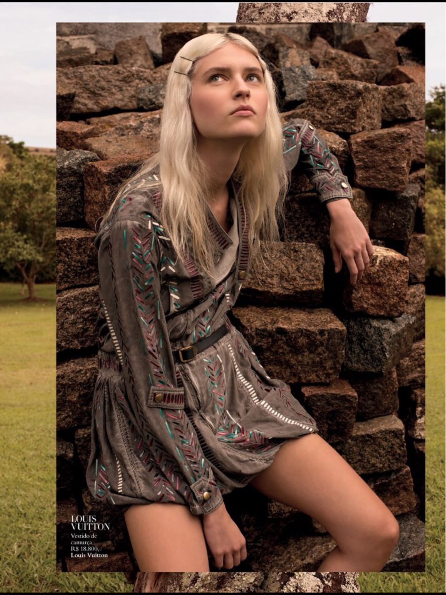 Ana Schurmann for Harper's Bazaar Brasil, shot by Rafael Pavarotti — embroidered suede Louis Vuitton dress, photographed against a stone wall